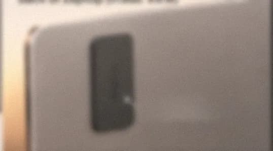 The steel plate on the back of a laptop lid, frosted