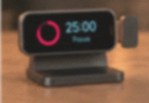 Hanu Pod on its desk stand showing a focus timer, frosted